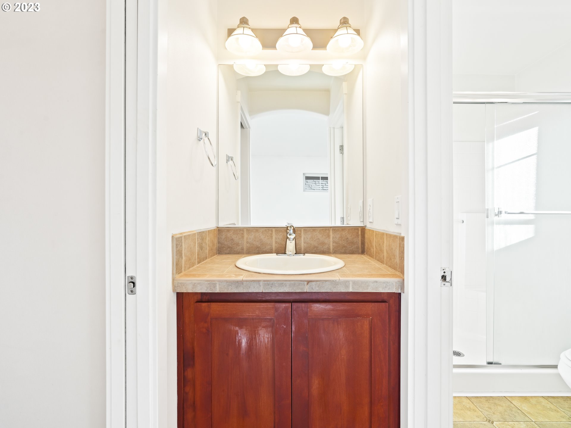 1253 Southwest 162nd Avenue Beaverton, OR 97006 - Photo 42 of 48 a bathroom with a sink and a mirror