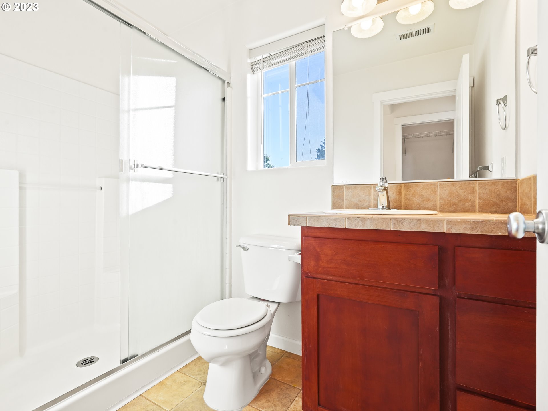 1253 Southwest 162nd Avenue Beaverton, OR 97006 - Photo 43 of 48 a bathroom with a toilet a sink and a mirror