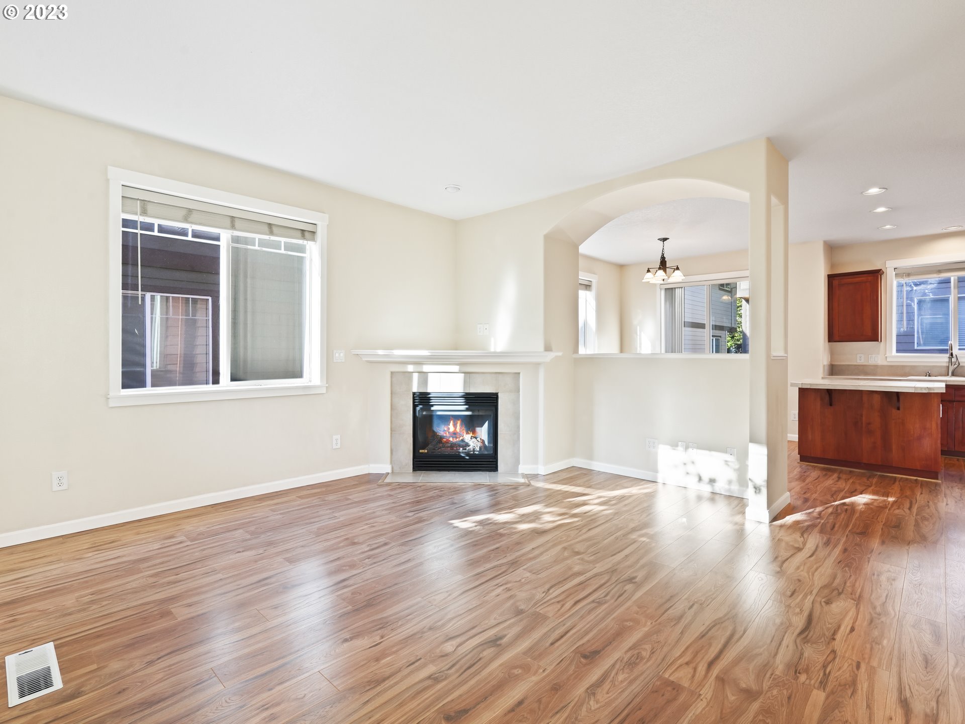 1253 Southwest 162nd Avenue Beaverton, OR 97006 - Photo 7 of 48 a view of a room with wooden floor and fireplace