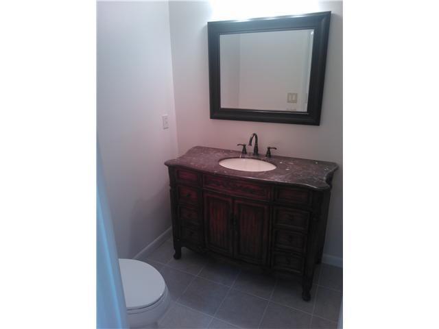 6170 Vía Tierra Boca Raton, FL 33433 - Photo 2 of 17 a bathroom with a toilet sink and mirror