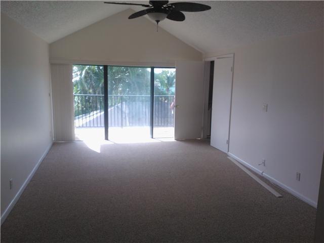 6170 Vía Tierra Boca Raton, FL 33433 - Photo 14 of 17 a view of a livingroom with a ceiling fan and window