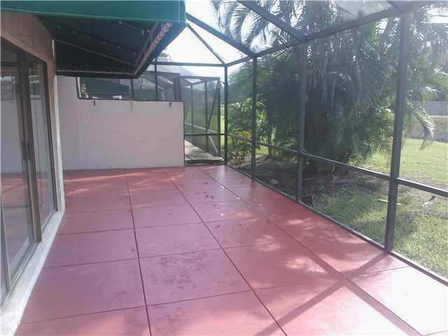 6170 Vía Tierra Boca Raton, FL 33433 - Photo 15 of 17 a view of backyard and porch
