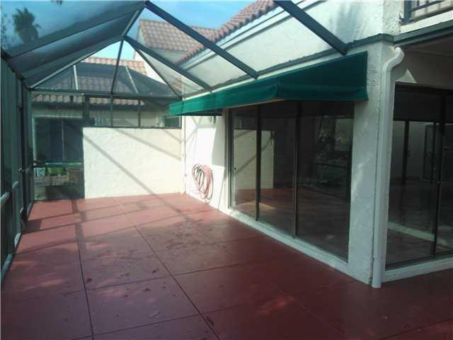 6170 Vía Tierra Boca Raton, FL 33433 - Photo 16 of 17 a house with yard in front of it