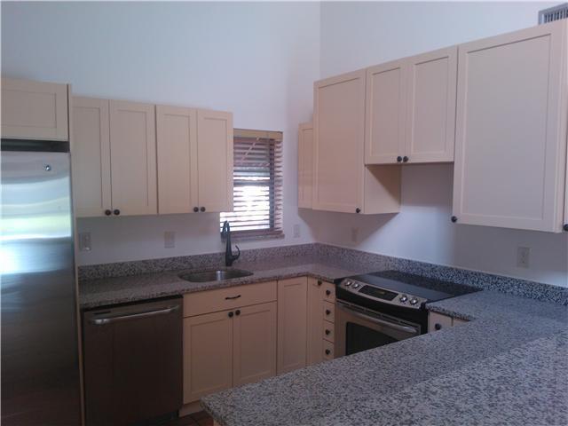 6170 Vía Tierra Boca Raton, FL 33433 - Photo 7 of 17 a kitchen with granite countertop a sink a stove and cabinets