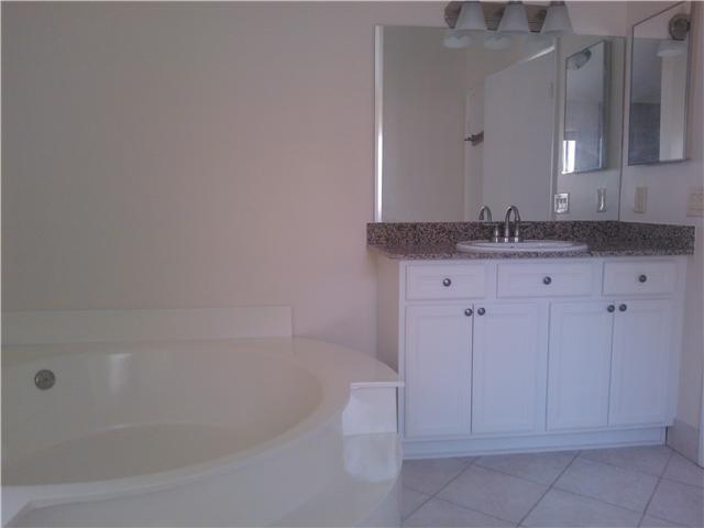 6170 Vía Tierra Boca Raton, FL 33433 - Photo 10 of 17 a bathroom with a granite countertop sink and tub