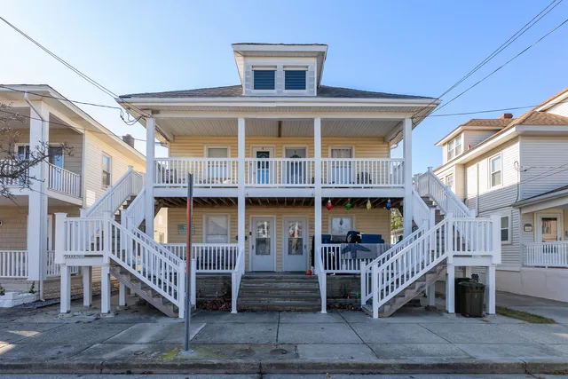 a front view of a house with a deck