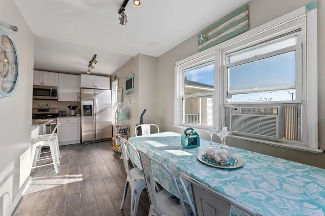 a kitchen with sink and refrigerator