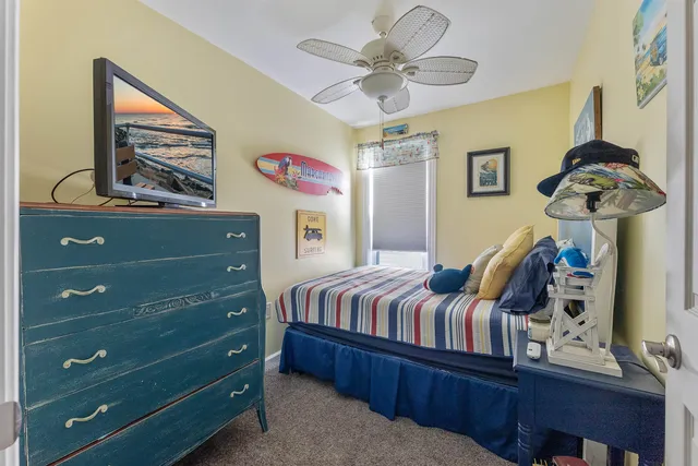a bedroom with bed and wooden floor