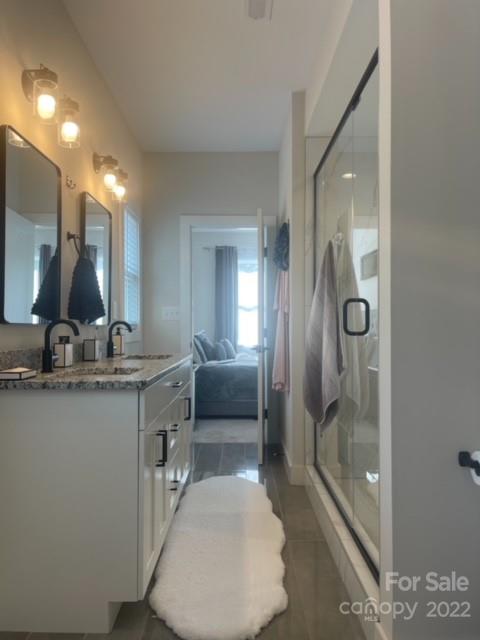 3047 Ridge Avenue Charlotte, NC 28208 - Photo 25 of 38 a bathroom with a sink a toilet and shower