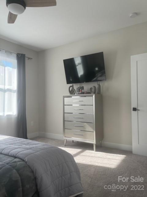 3047 Ridge Avenue Charlotte, NC 28208 - Photo 26 of 38 a bedroom with a bed and a flat screen tv