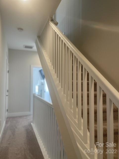 3047 Ridge Avenue Charlotte, NC 28208 - Photo 29 of 38 a view of staircase with railing and white walls