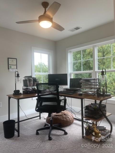 3047 Ridge Avenue Charlotte, NC 28208 - Photo 32 of 38 a living room with furniture a window and a chandelier