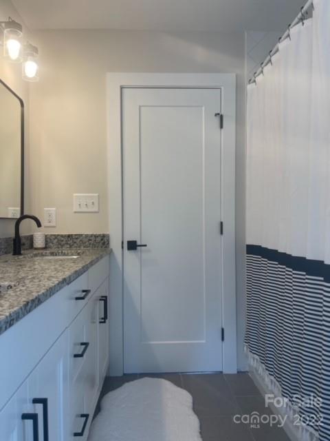 3047 Ridge Avenue Charlotte, NC 28208 - Photo 37 of 38 a bathroom with a granite countertop sink toilet and shower