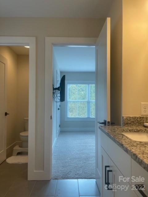 3047 Ridge Avenue Charlotte, NC 28208 - Photo 38 of 38 a view of bathroom with a granite countertop sink and a mirror