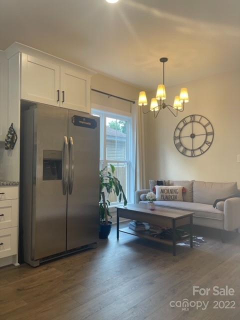3047 Ridge Avenue Charlotte, NC 28208 - Photo 9 of 38 a living room with furniture and a chandelier