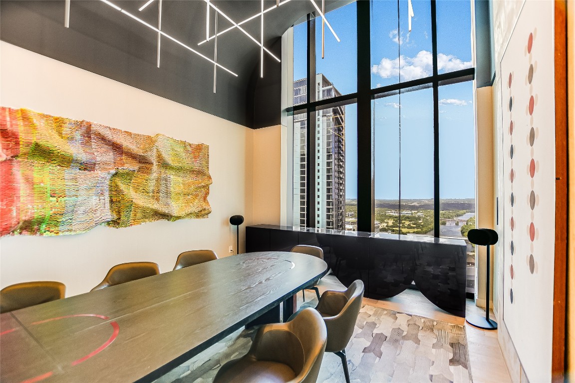 610 Davis Street, Unit 3110 Austin, TX 78701 - Photo 22 of 34 a view of a dining room with furniture and a window