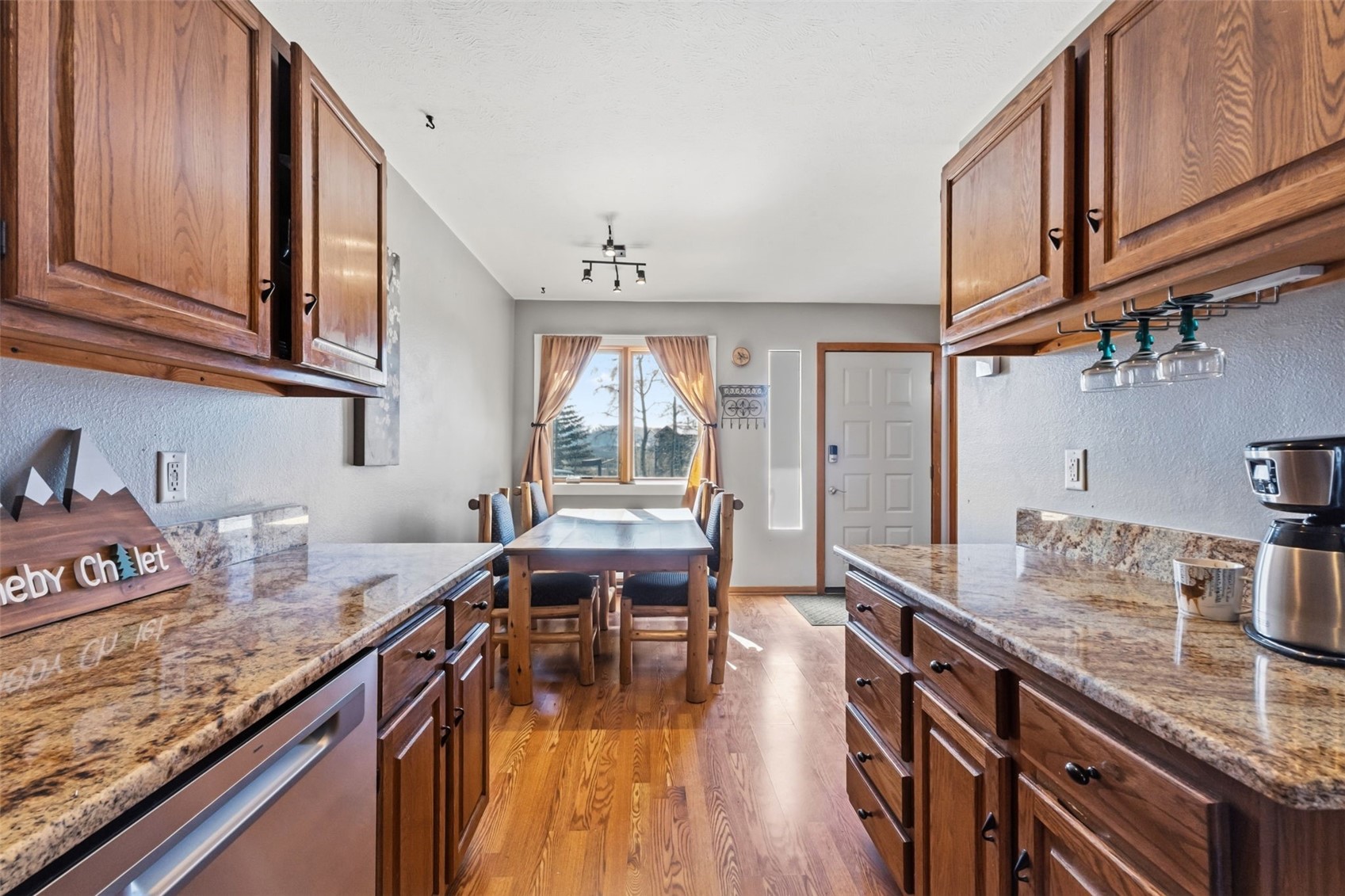 6734 Ryan Gulch Road, Unit 6734 Silverthorne, CO 80498 - Photo 11 of 33 a kitchen with granite countertop lots of counter top space