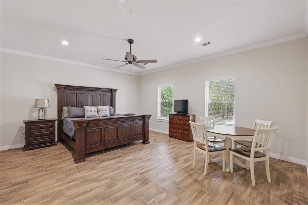 2446 Neely Trail Valley View, TX 76272 - Photo 12 of 29 a bedroom with furniture and wooden floor