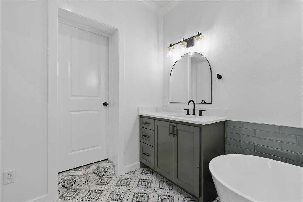 2446 Neely Trail Valley View, TX 76272 - Photo 16 of 29 a bathroom with a toilet sink and mirror