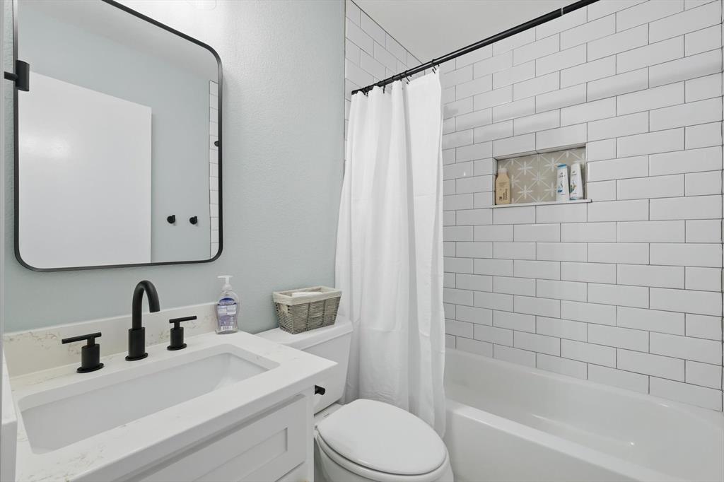 2446 Neely Trail Valley View, TX 76272 - Photo 20 of 29 a bathroom with a sink toilet and shower