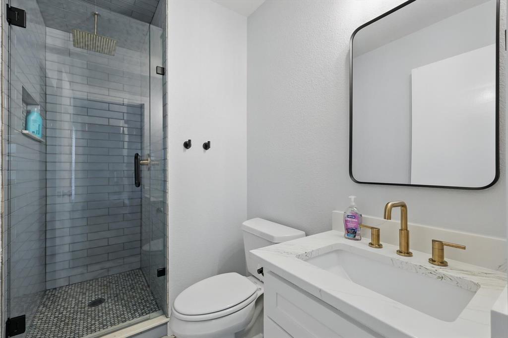 2446 Neely Trail Valley View, TX 76272 - Photo 22 of 29 a bathroom with a sink toilet and shower