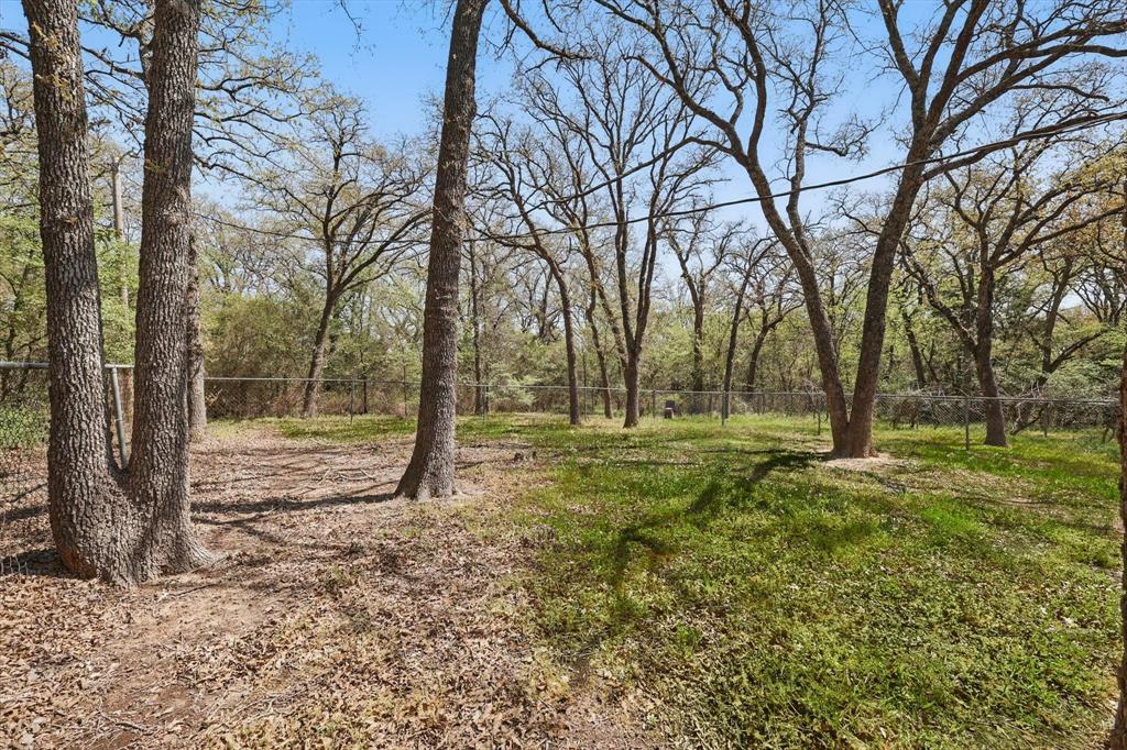 2446 Neely Trail Valley View, TX 76272 - Photo 25 of 29 a view of outdoor space with trees