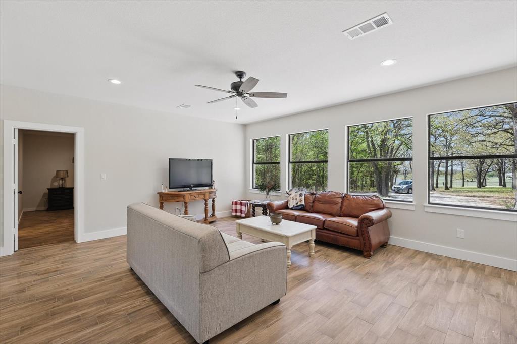 2446 Neely Trail Valley View, TX 76272 - Photo 8 of 29 a living room with furniture and a flat screen tv