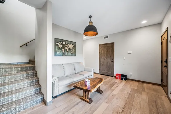 a view of a dining room with furniture window and wooden floor