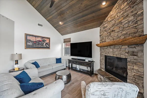 a view of a fireplace with furniture