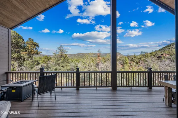 a view of a balcony with furniture