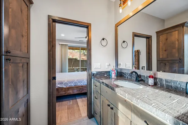 a bedroom with a large bed and a window