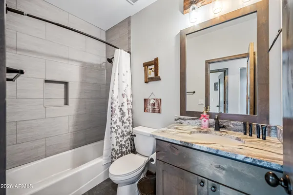 a bathroom with a sink a toilet and a bathtub