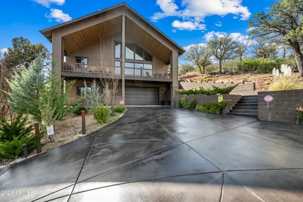 a view of a pathway both side of house
