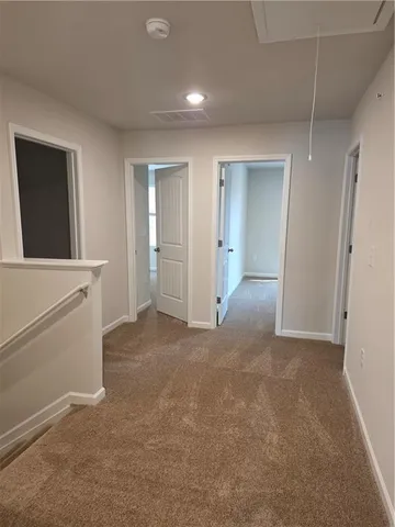 wooden floor with white walls