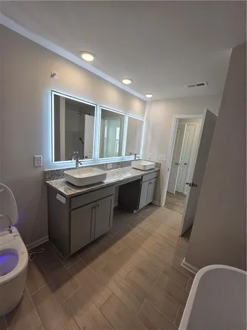 a bathroom with a toilet and sink