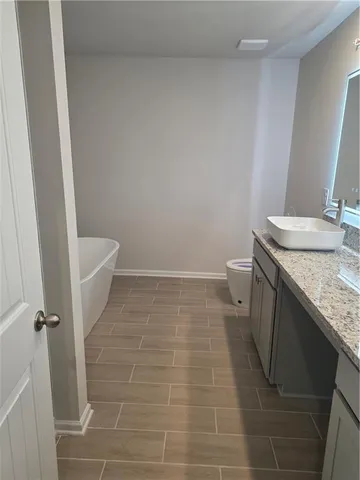 a bathroom with a sink and a toilet