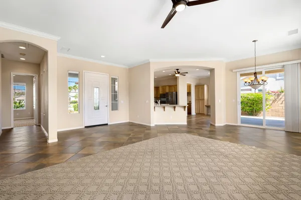 a view of a room with a window and stairs