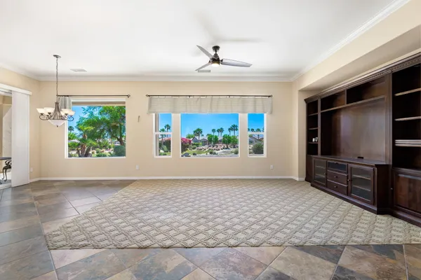 a view of a livingroom with furniture window and front door