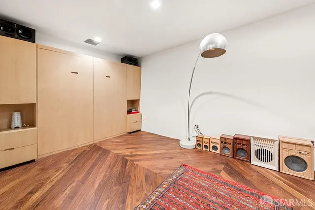 a bed room with a bed and a night stand