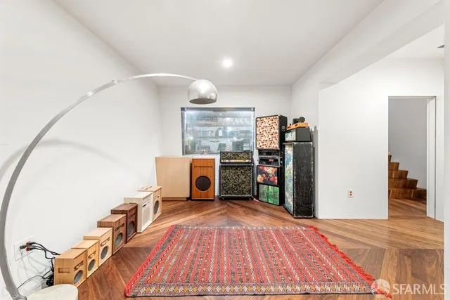 a room with furniture a flat screen tv and a table