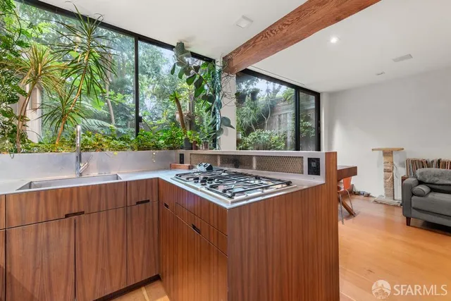 a living room with furniture and a book shelf