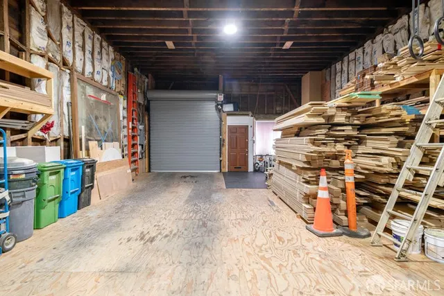 a view of an empty room with wooden walls