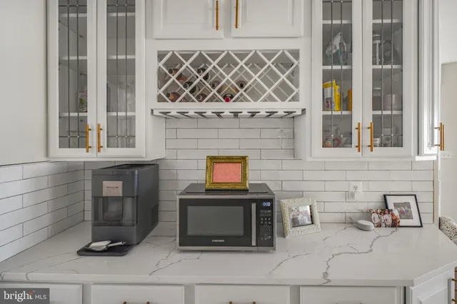 a living room with furniture city view and large windows