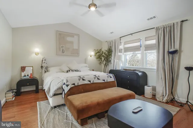 a bedroom with a workspace