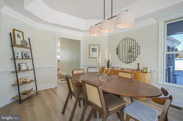 a bedroom with furniture and a chandelier