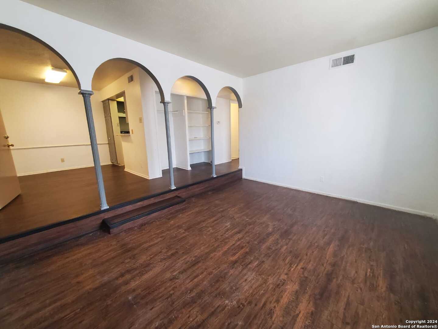 170 De Chantle Road, Unit 208 San Antonio, TX 78201 - Photo 5 of 14 a view of a room with wooden floor