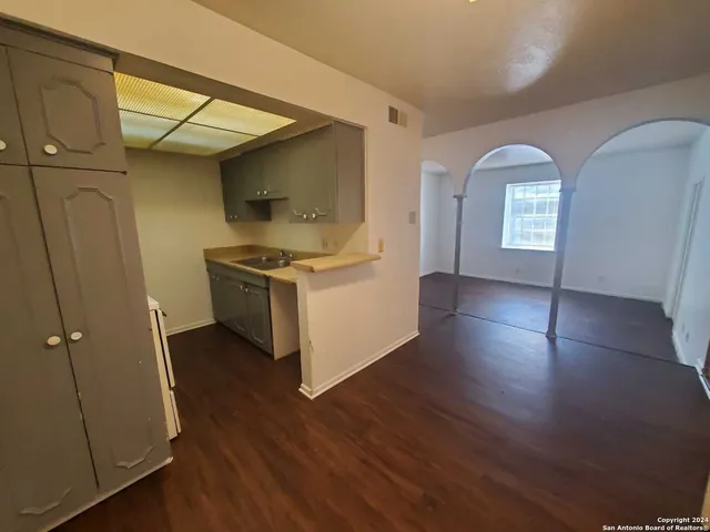 a kitchen with stainless steel appliances granite countertop a stove and a refrigerator