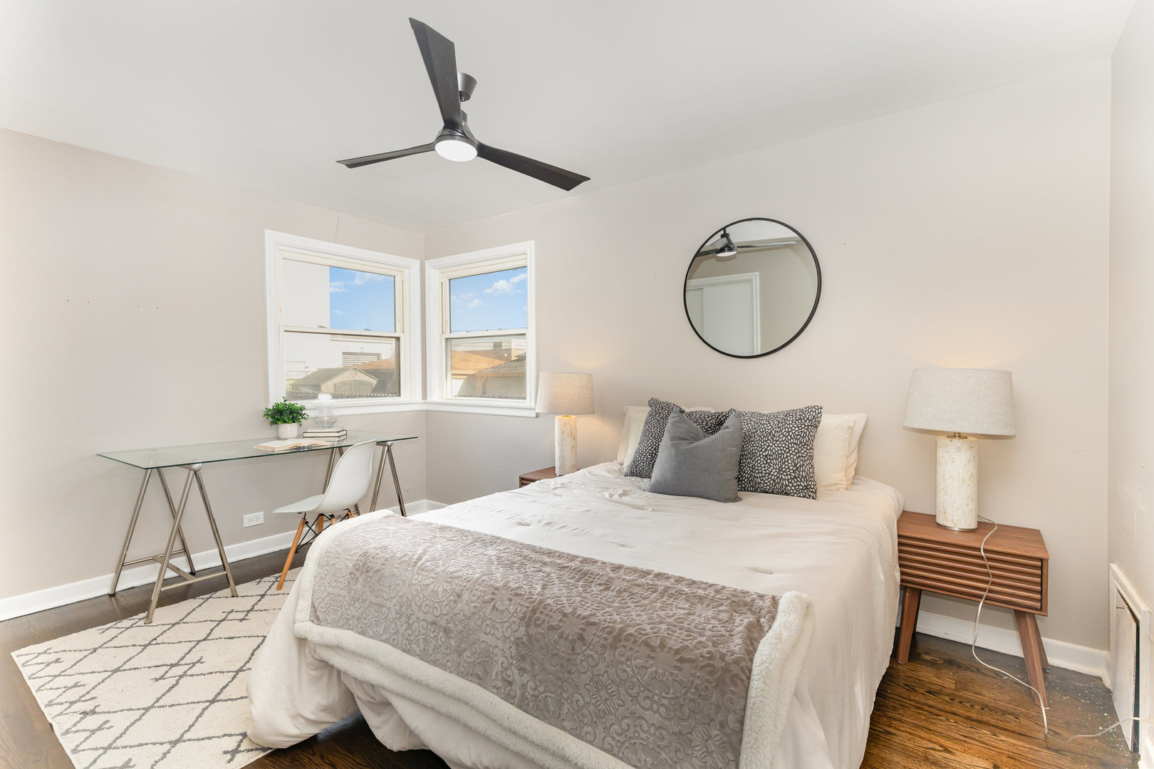 4852 West Hirsch Street Chicago, IL 60651 - Photo 13 of 38 a bedroom with a bed a chair and a potted plant