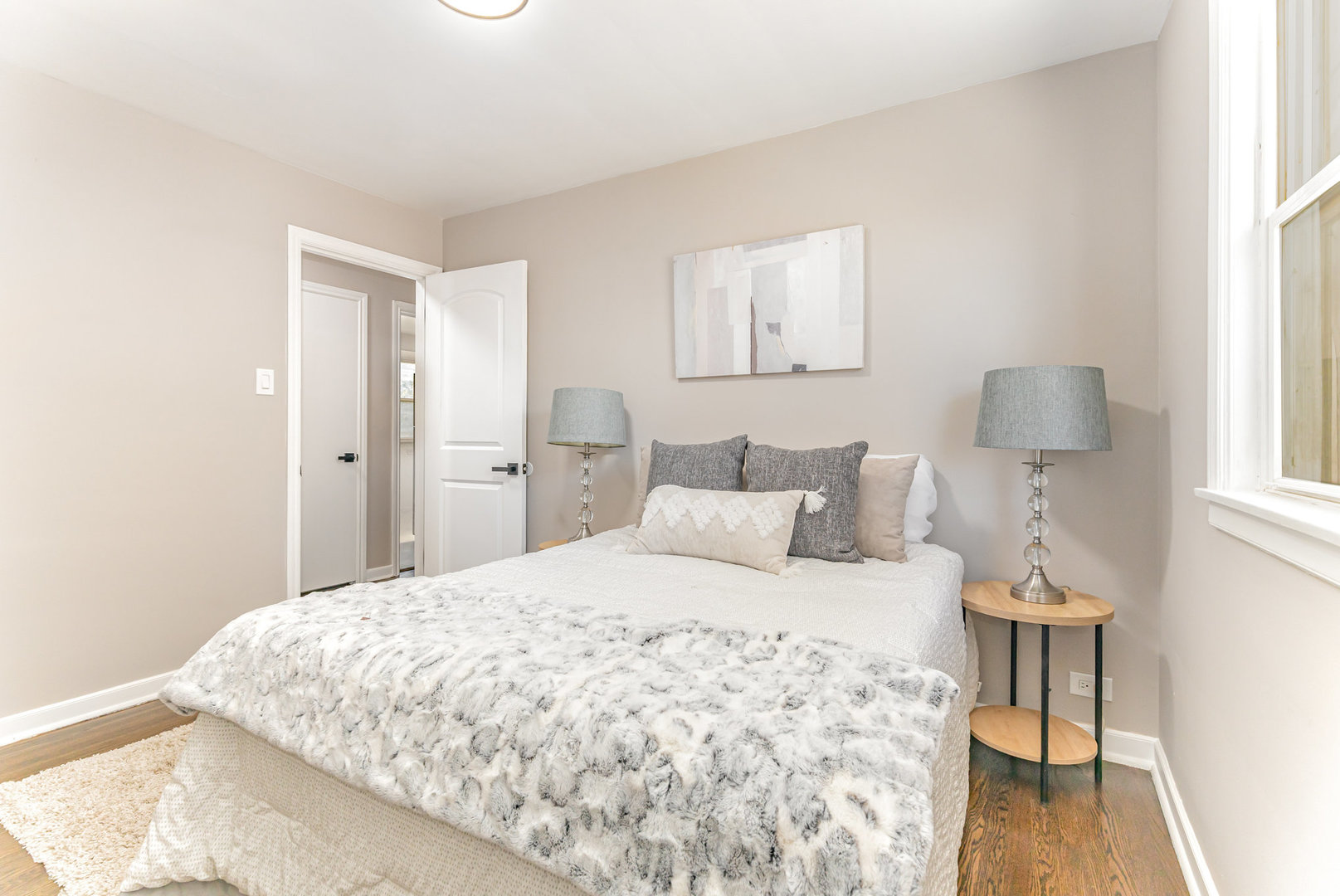 4852 West Hirsch Street Chicago, IL 60651 - Photo 18 of 38 a bedroom with a bed and a table