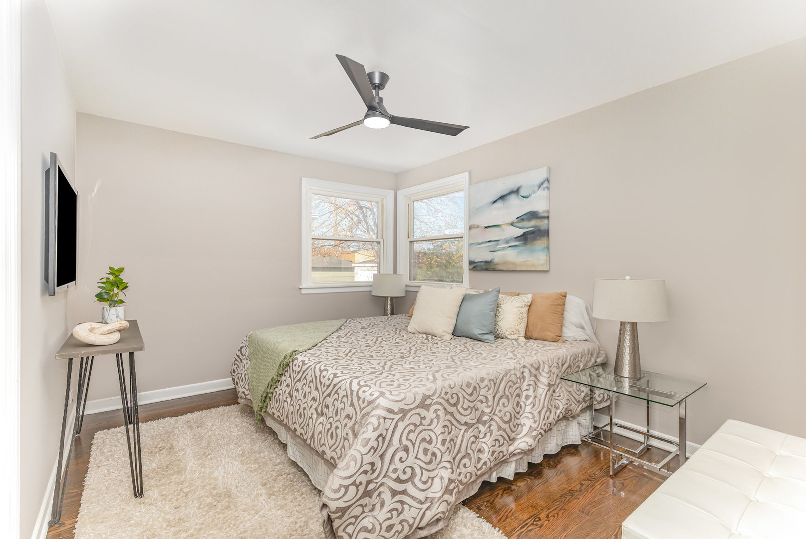 4852 West Hirsch Street Chicago, IL 60651 - Photo 19 of 38 a bedroom with a bed potted plant with the wooden floor